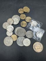 A selection of USA dollar and half dollar coins, Kennedy, Eisenhower and others