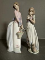 Two Boxed Lladro figures, a lady glancing over her shoulder with a basket of flowers and a girl with