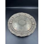 A silver tray on three feet, hallmarked for Sheffield 1909 by Joseph Rodgers & Sons