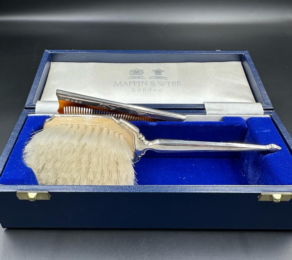 A Mappin and Webb hallmarked Child's silver brush and comb set, cased with original receipt. - Image 2 of 3