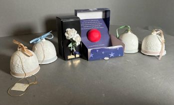 A selection of boxed Lladro collectibles to include the winter bells and the autumn bells