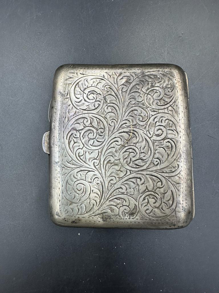 A silver, engraved cigarette case, hallmarked for Birmingham 1927, makers mark E & S.