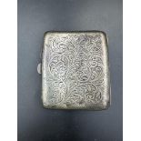 A silver, engraved cigarette case, hallmarked for Birmingham 1927, makers mark E & S.