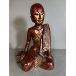 A wooden carved statue of a Mandalay monk painting in red and gold (H44cm)