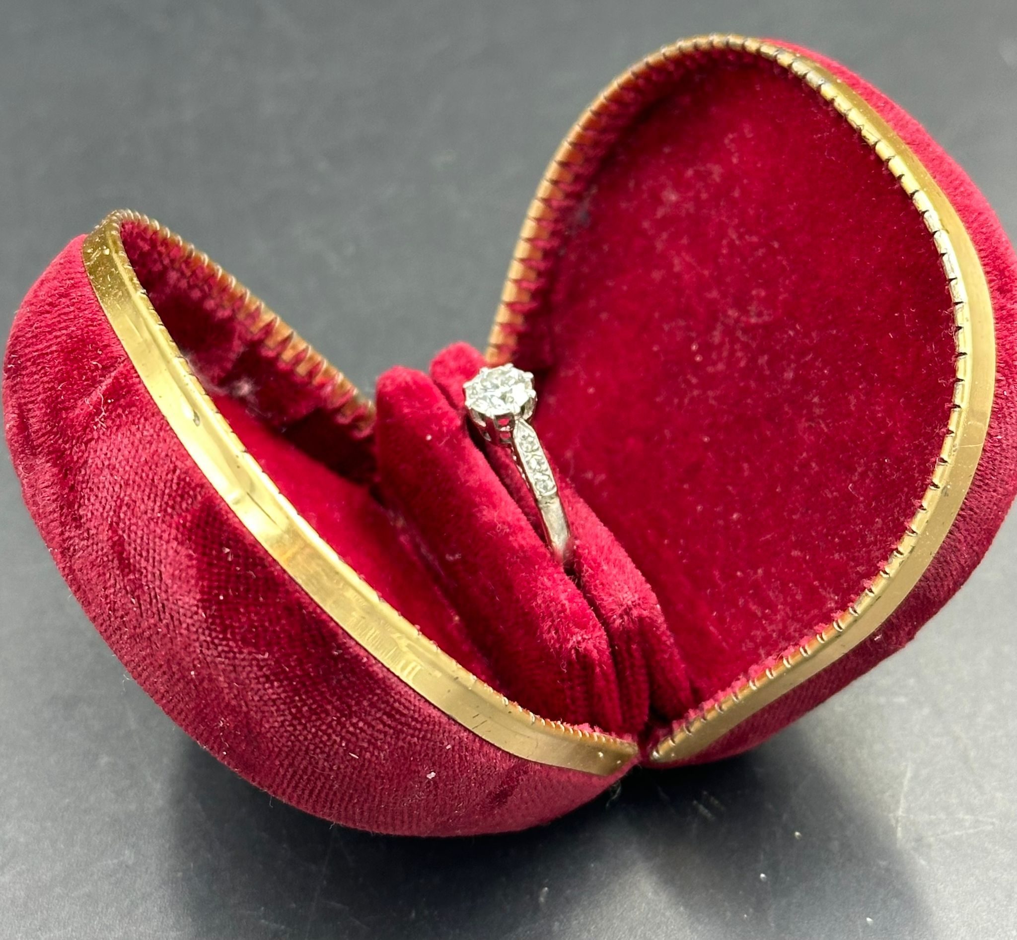 A single stone diamond ring with diamond set shoulders. Round Brilliant cut diamond 0.64ct, Colour - Image 2 of 6