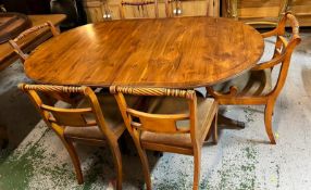A yew dining table and chairs