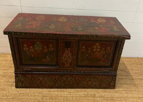 A folk painted chest open to front (H60cm W98cm D41cm)