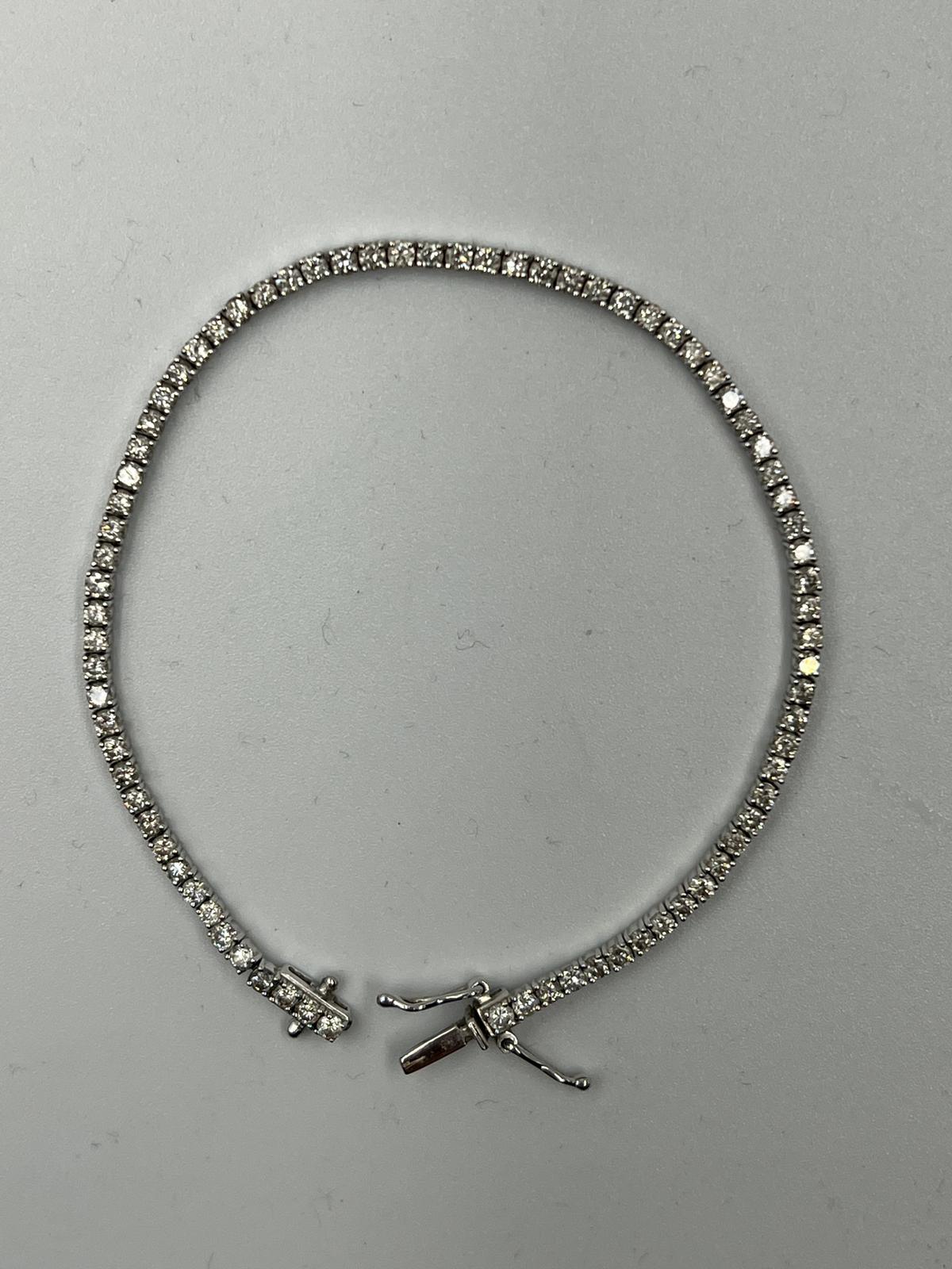 An 18ct white gold Tennis or line bracelet set with approximately 3ct of diamonds. - Image 11 of 25