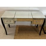 A mirrored vanity table with drawers to each end (H76cm W122cm D40cm)