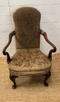A George II style mahogany open arm chair by Babtholmew and Fletcher London