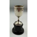 A miniature silver cup on stand, hallmarked for Birmingham