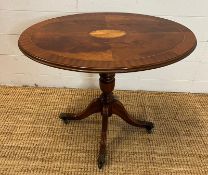 An oval inlaid side table