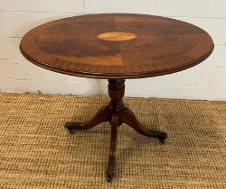 An oval inlaid side table