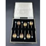 A boxed set of silver coffee bean spoons, hallmarked for Birmingham by A J Bailey, 1960