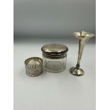 Hallmarked silver to include a napkin ring, spill vase and glass jar with silver lid