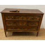 A Louis style commode with three drawers between fluted uprights (H84cm W114cm D47cm) Condition