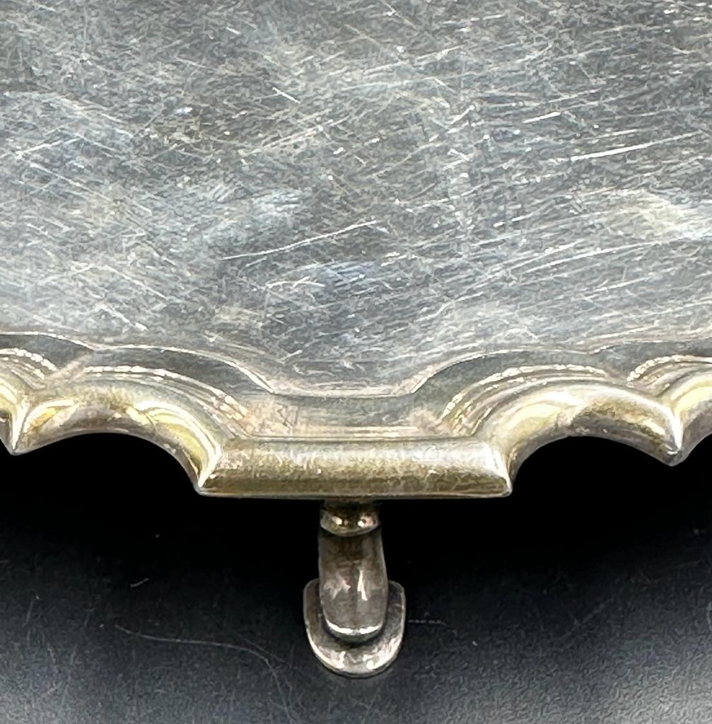 A Carrington & Co silver tray on three horseshoe feet, hallmarked for London 1936 (Approximate - Image 3 of 3