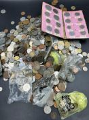 A large quantity of foreign coins, several kilos