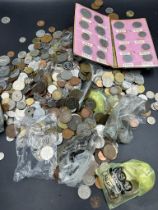 A large quantity of foreign coins, several kilos