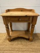 A pine single drawer side table with galleried top and shelf under (H68cm W60cm D35cm)