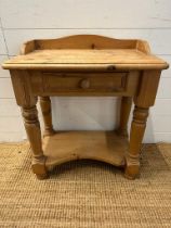 A pine single drawer side table with galleried top and shelf under (H68cm W60cm D35cm)