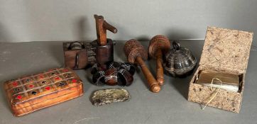 A selection of curios to include Buddhist prayer wheels, a bronze bell and coasters