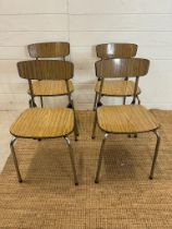 A set of four Mid Century Formica stacking chairs