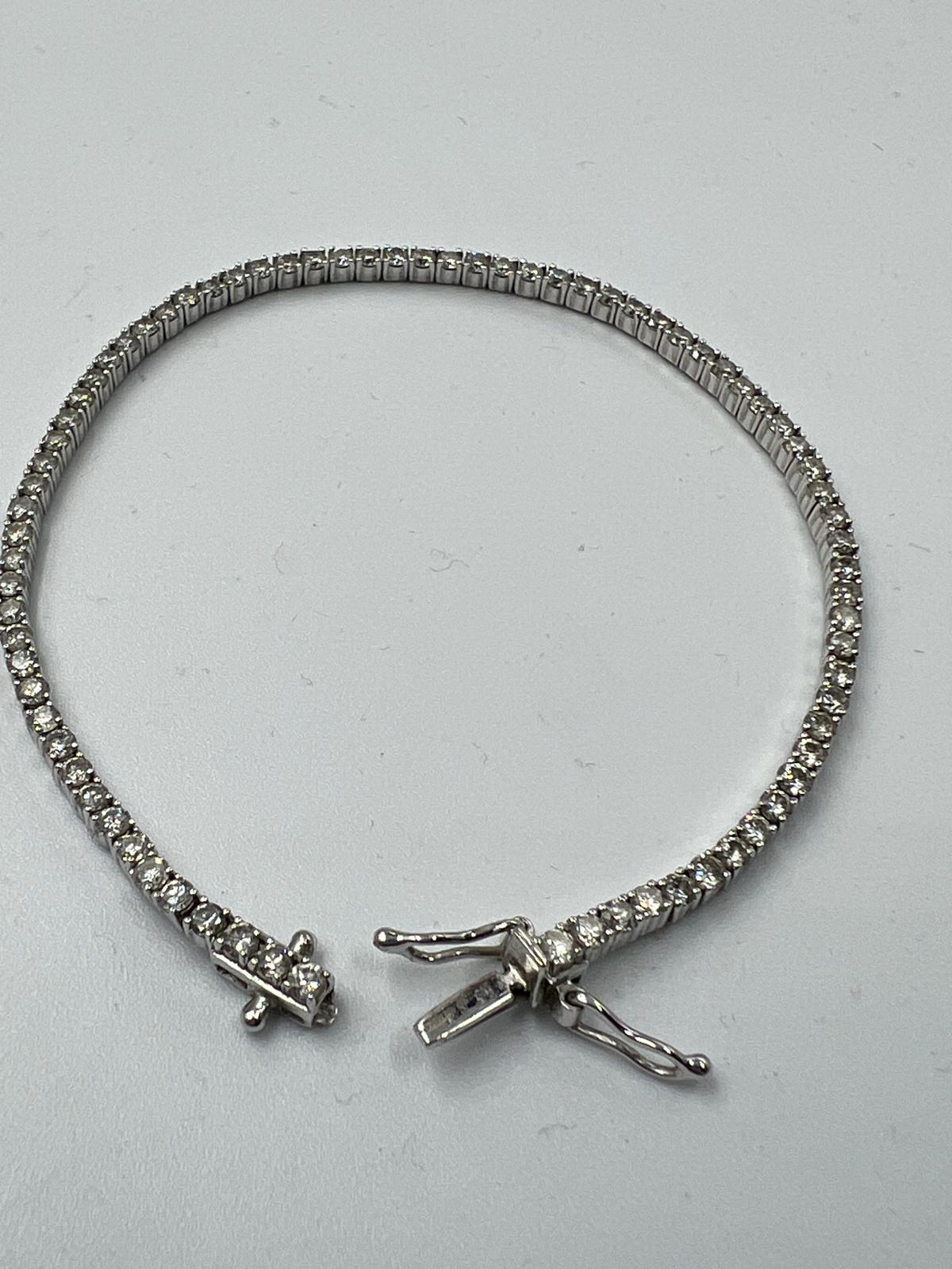 An 18ct white gold Tennis or line bracelet set with approximately 3ct of diamonds. - Image 7 of 25