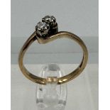A two stone diamond ring on a 9ct gold setting, approximate size P and weight 2.6g.