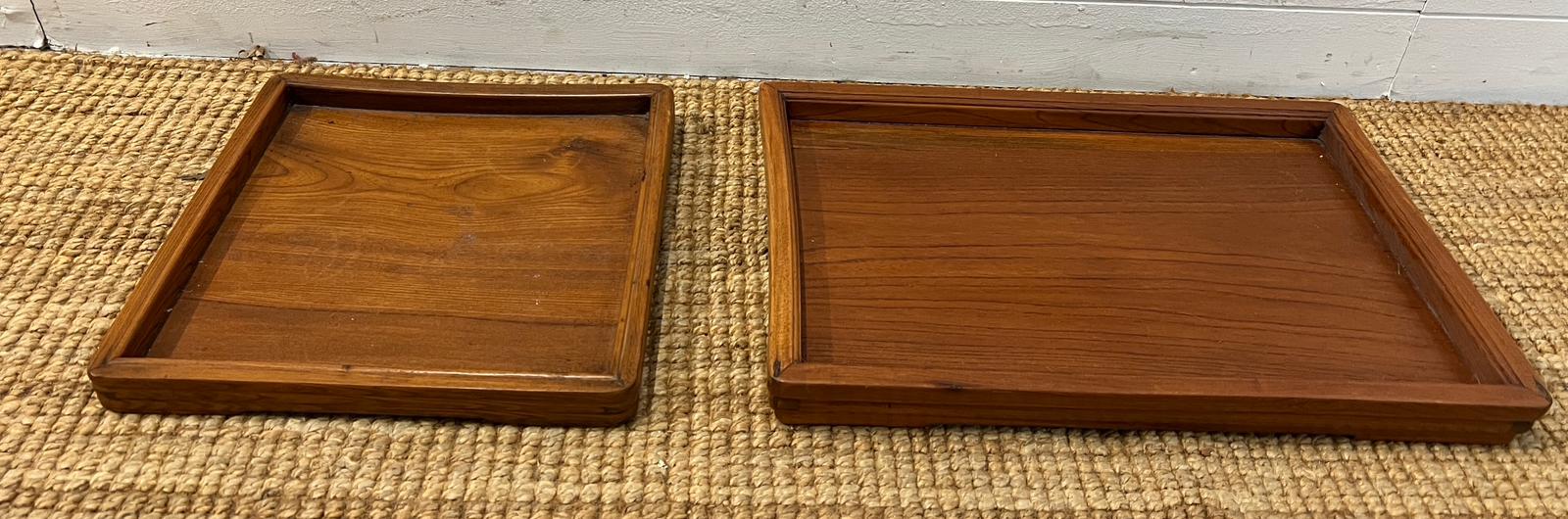 Two wooden oriental trays