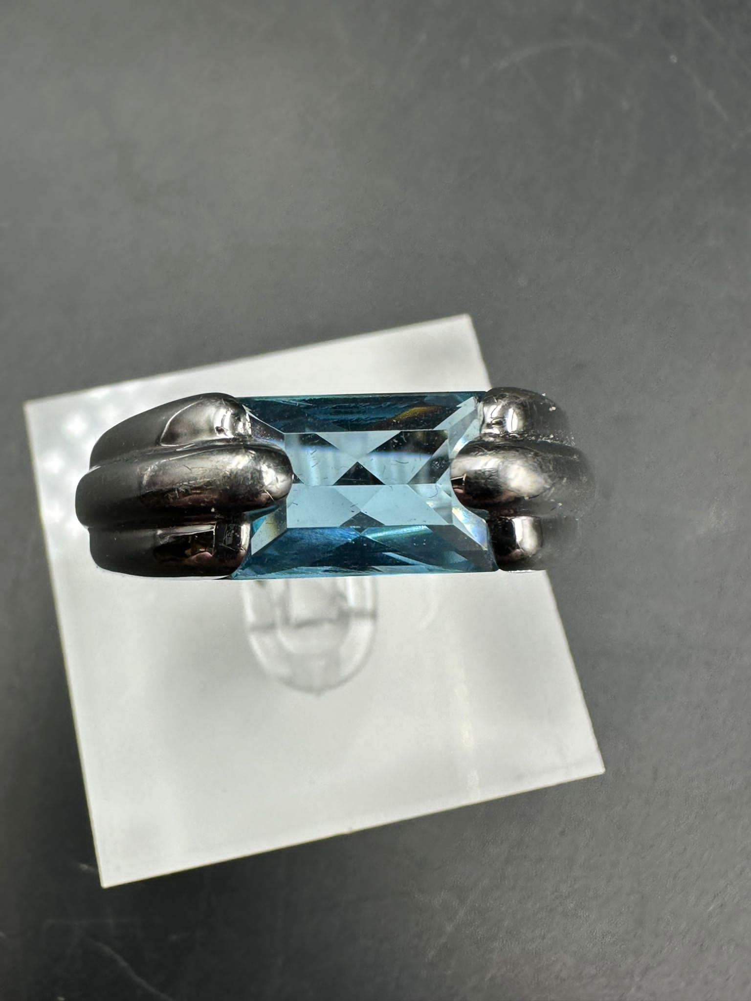 A single stone Audemars Piguet ring consisting of a rectangular mixed cut blue topaz stone (12.1mm x - Image 3 of 5