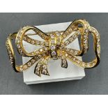 A stunning 18ct gold and diamond bow brooch ( Approximate Total Weight 16.5g)
