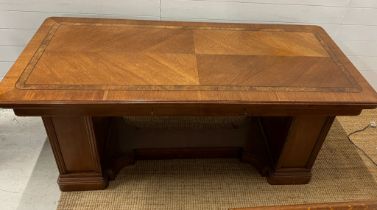 An Art Deco partners desk with inlaid top, cupboards to side (H76cm W170cm D74cm)