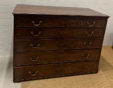 A large mahogany chest of drawers with five long graduating drawers and brass handles (H104cm W140cm