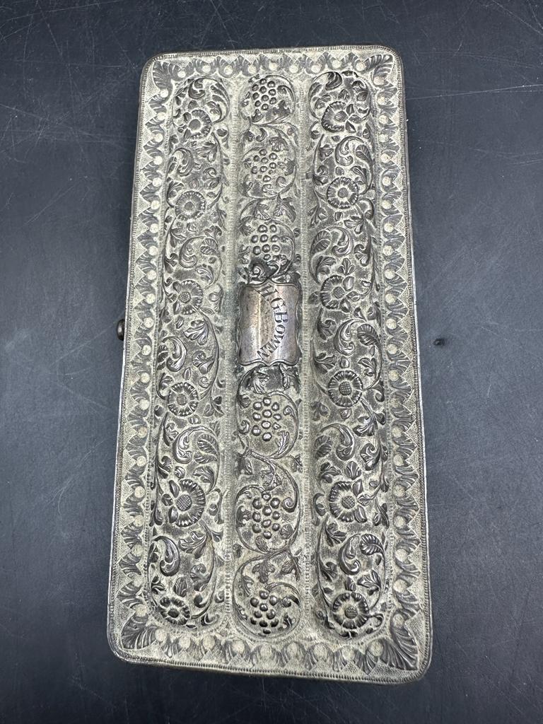 An Indian silver cigar case with floral engraving