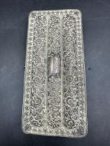 An Indian silver cigar case with floral engraving