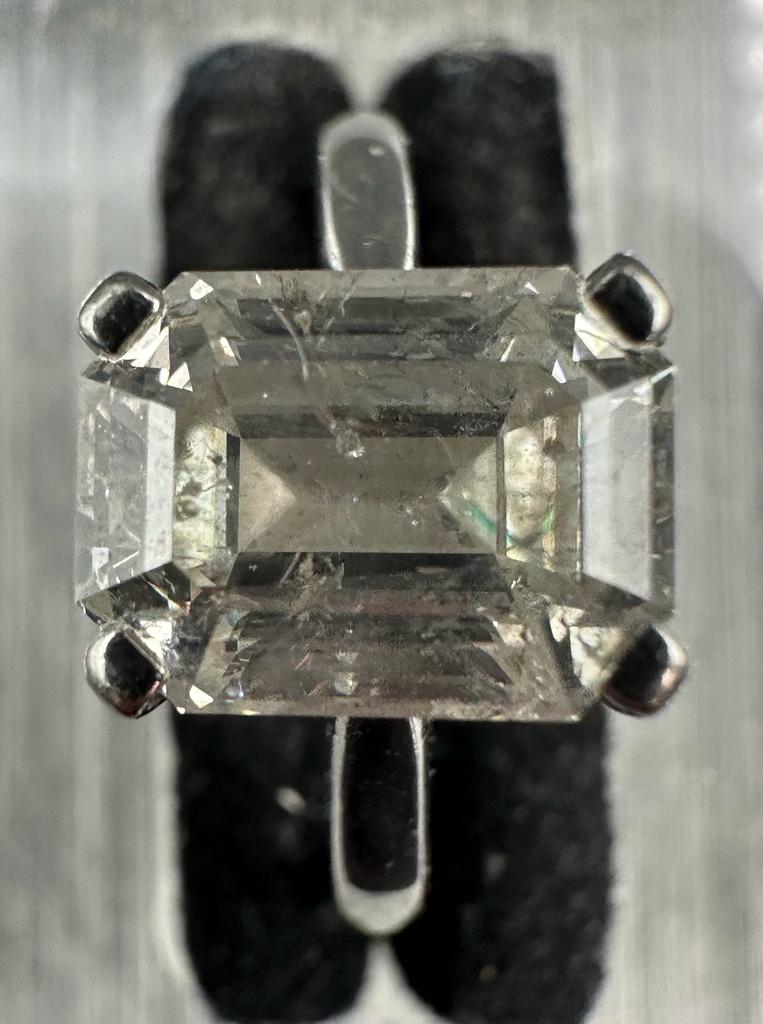 A 3.26ct emerald cut diamond which commercial White and PK3 quality, four claw platinum set on a - Image 4 of 5