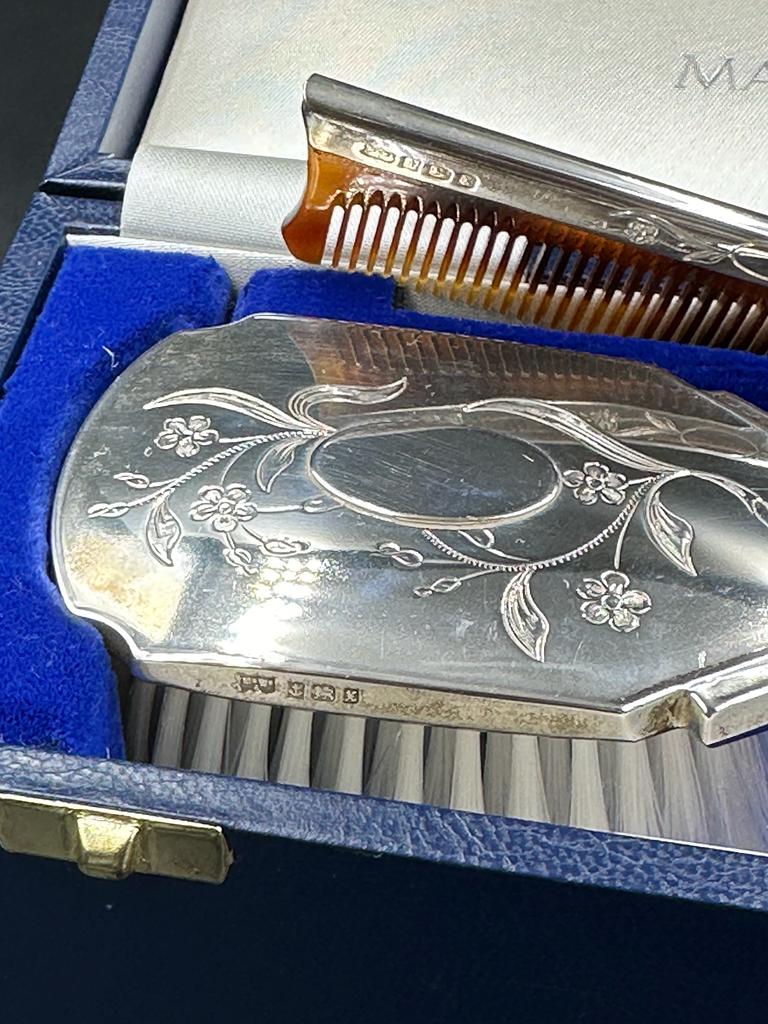 A Mappin and Webb hallmarked Child's silver brush and comb set, cased with original receipt. - Image 3 of 3