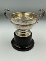 A two handled trophy on stand Approximate Total Weight 84g, hallmarked for Birmingham 1931 by