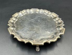 A Carrington & Co silver tray on three horseshoe feet, hallmarked for London 1936 (Approximate