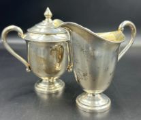 A Sterling silver milk jug and lidded sugar bowl (Combined Total Weight 274g)