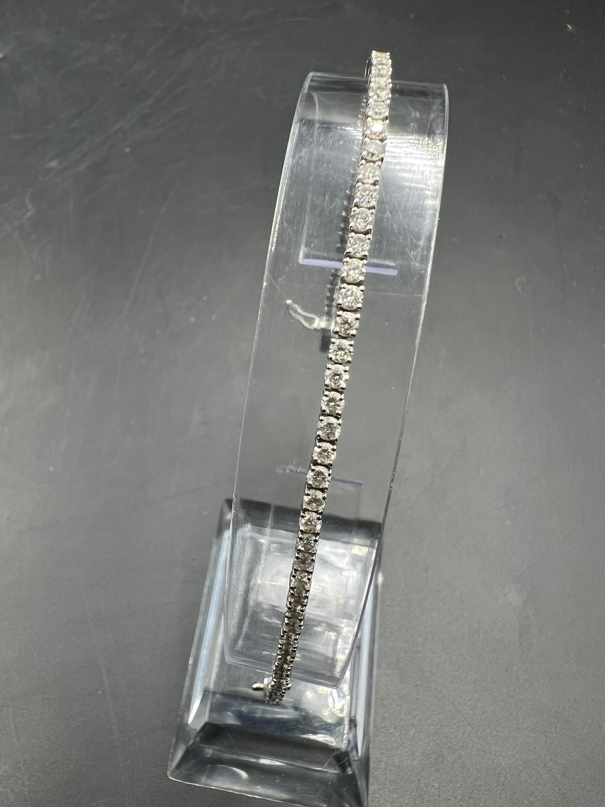 An 18ct white gold Tennis or line bracelet set with approximately 3ct of diamonds. - Image 22 of 25