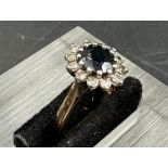 A 18ct gold sapphire and diamond cluster ring size i.5