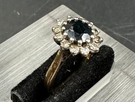A 18ct gold sapphire and diamond cluster ring size i.5
