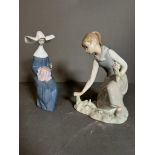 Two Lladro figures a Nun Crocheting and a young girl picking flowers Condition Report good condition