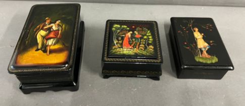 Three lacquered boxes with courting couples to front