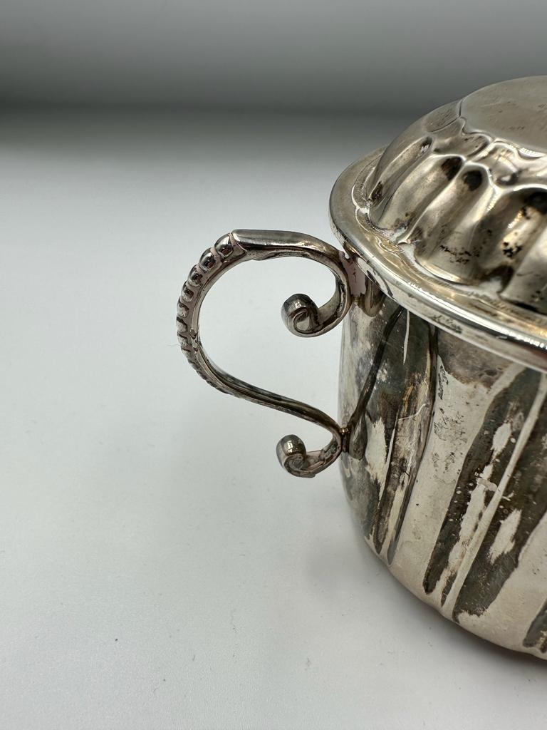 A silver lidded sugar bowl marked to base Carrington & Co 130 Regent Street, hallmarked London 1892, - Image 4 of 4