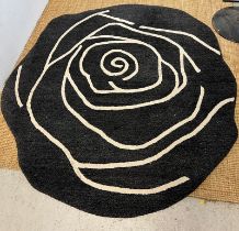 An Anna Charlotte of Stockholm carpet with black grounds in the form of a rose (196cm x 190cm)