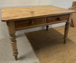 A Victorian style pine dining or kitchen table comprising of two drawers on turned legs (H76cm