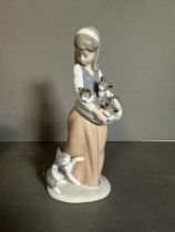 A boxed Lladro of a young girl with a basket of kittens Condition Report good condition